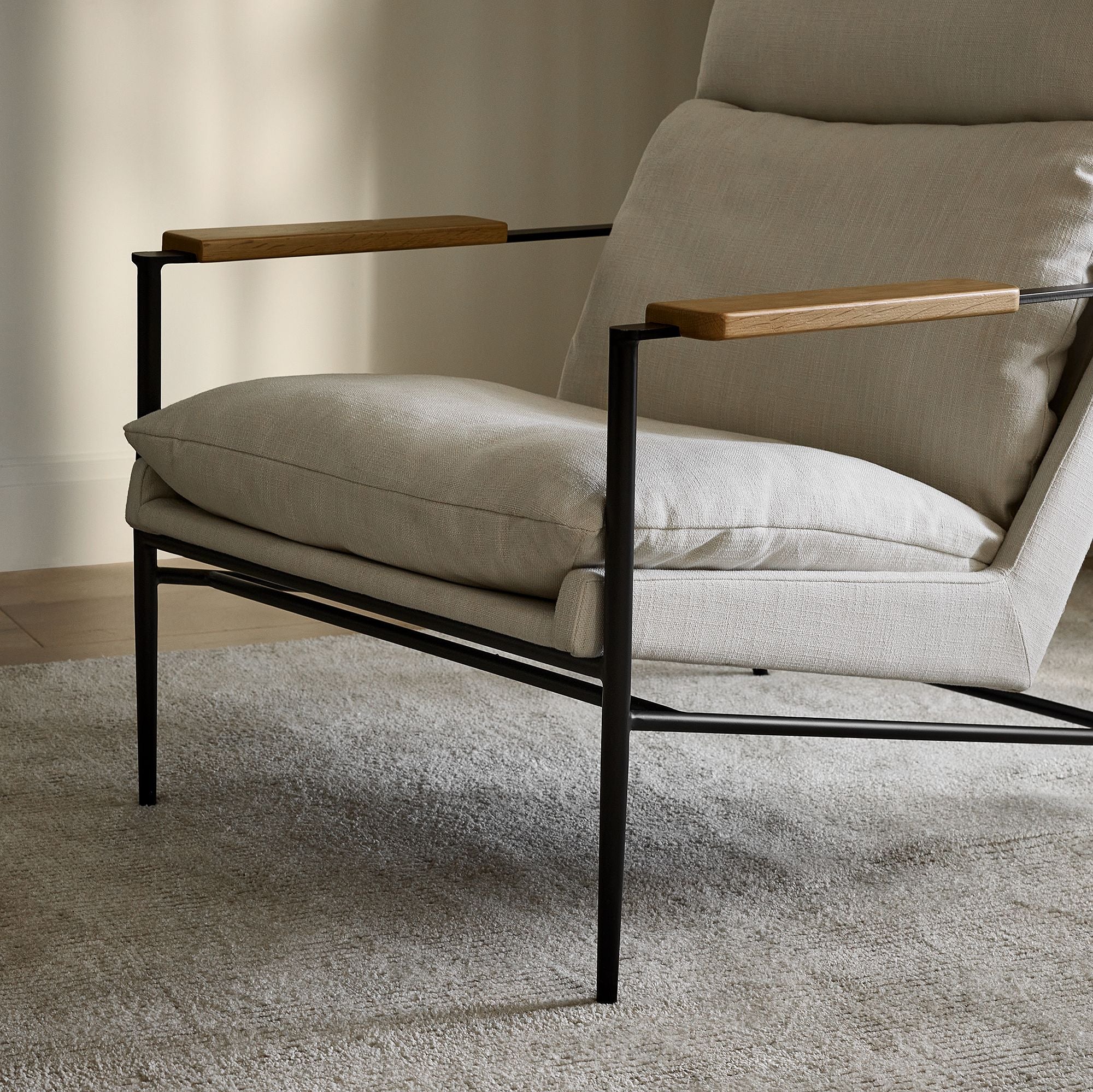 Lein Modern Lounge Chair in Cream Upholstery with Black Metal Frame & Wooden Armrests